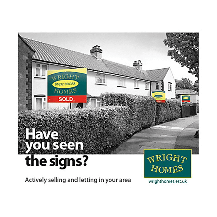 estate agent leaflet with boards in the street