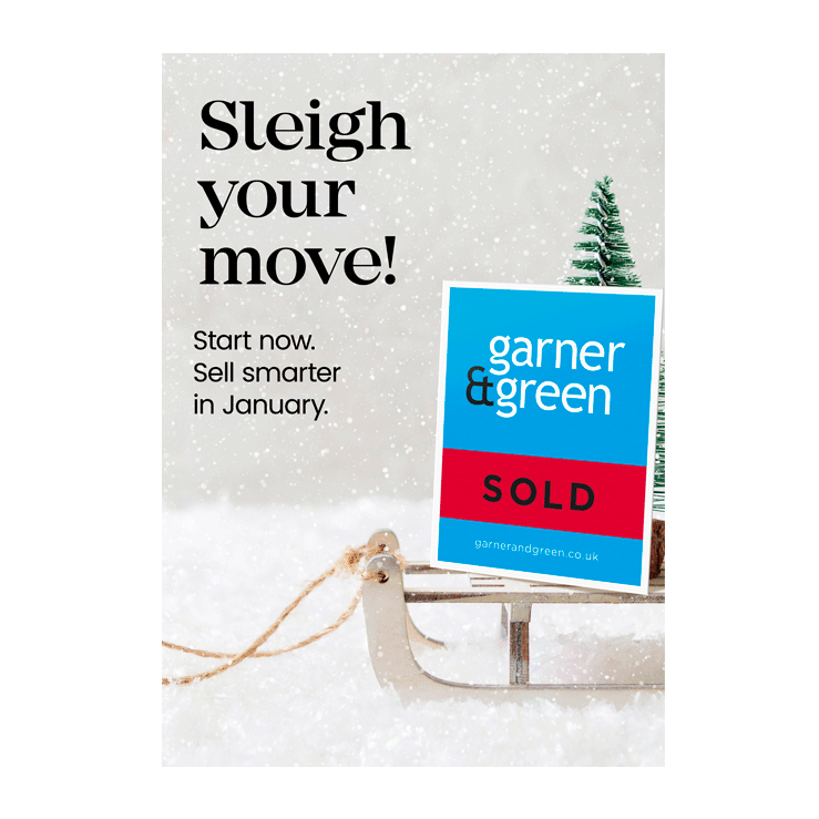 Sleigh in snow carrying a Garner & Green SOLD board